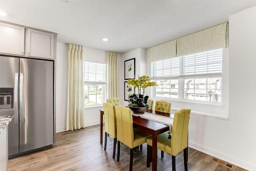A true dining area flooded with natural light! *Model home, colors and selections will vary.