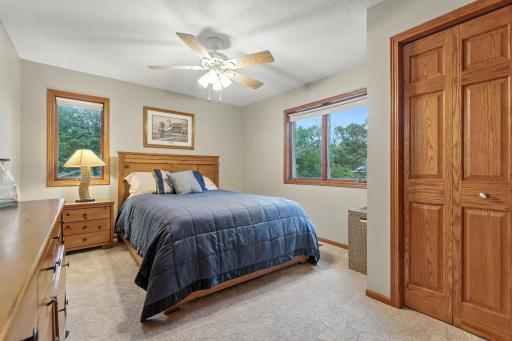 The 2nd bedroom of the home with tons of sunlight and beautiful woodwork.