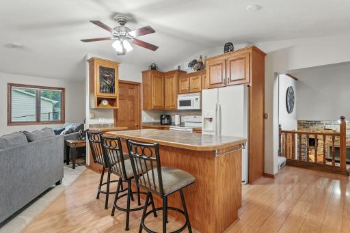 The beautiful kitchen includes a walk in pantry for extra storage needs plus tons of cabinetry and storage. The center island is perfect for those informal meals.