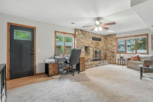 Another view of the family room area of the home. The door in view opens to a fenced area of the yard.