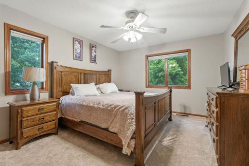 The upper level of the home has this large primary bedroom. Also on this level is the 2nd bedroom and a full bath.