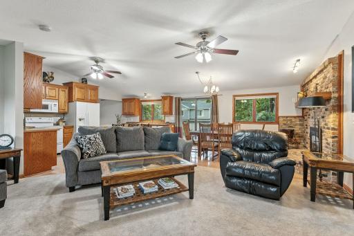 Such an inviting space - all your kitchen, dining and living areas and needs on the same level plus the patio door opens to the large deck for more entertaining room.