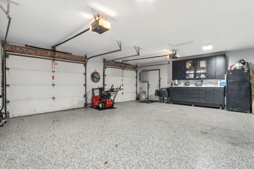 Look at this fabulous garage space. The cabinets are included but the refrigerator shown is no longer there.