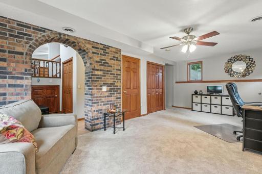 On this main, walkout level is the laundry/mechanical room plus a 3/4 bath. The archway could be closed in and a door added if a person wanted this area to be a 3rd bedroom.