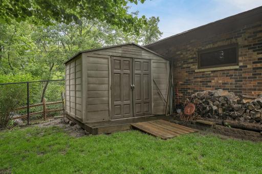 Shed in the rear area of the garage is great for extra storage needs. There is an additional shed by the deck which is optional to be included with the sale.