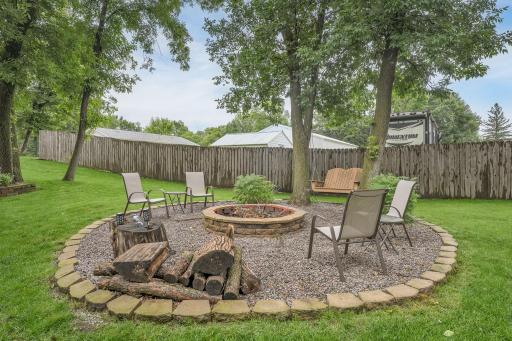 The fire pit in the backyard is perfect for gatherings - just bring the hot dogs and smores!