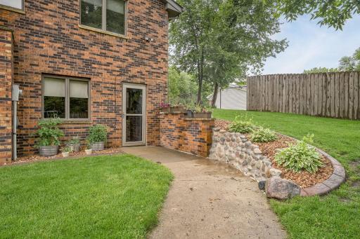 The side walk from the entry area leads to the driveway and detached garage.