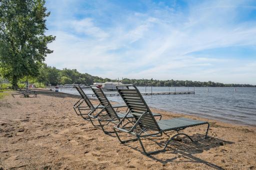 Summer and warm temps are right around the corner! Mandatory to join the lake association to lounge on the beach.