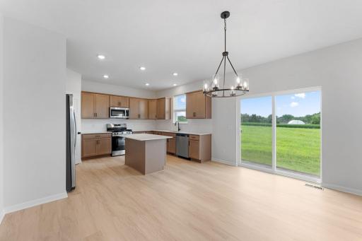 Enjoy amazing backyard views from the dining room, perfectly positioned next to the kitchen.