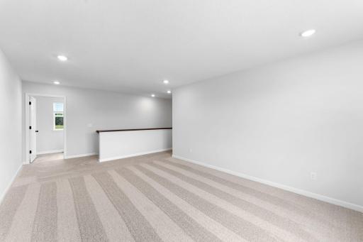 Upper level loft with direct access to the laundry room.