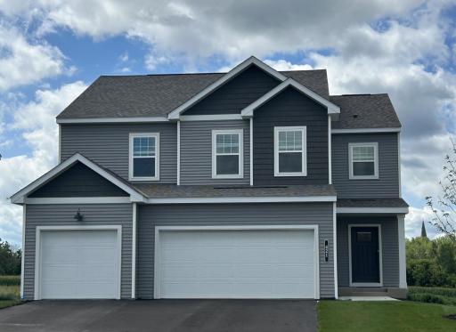 The Richmond Plan featuring a spacious 3-car garage, perfectly situated on a desirable walkout homesite.