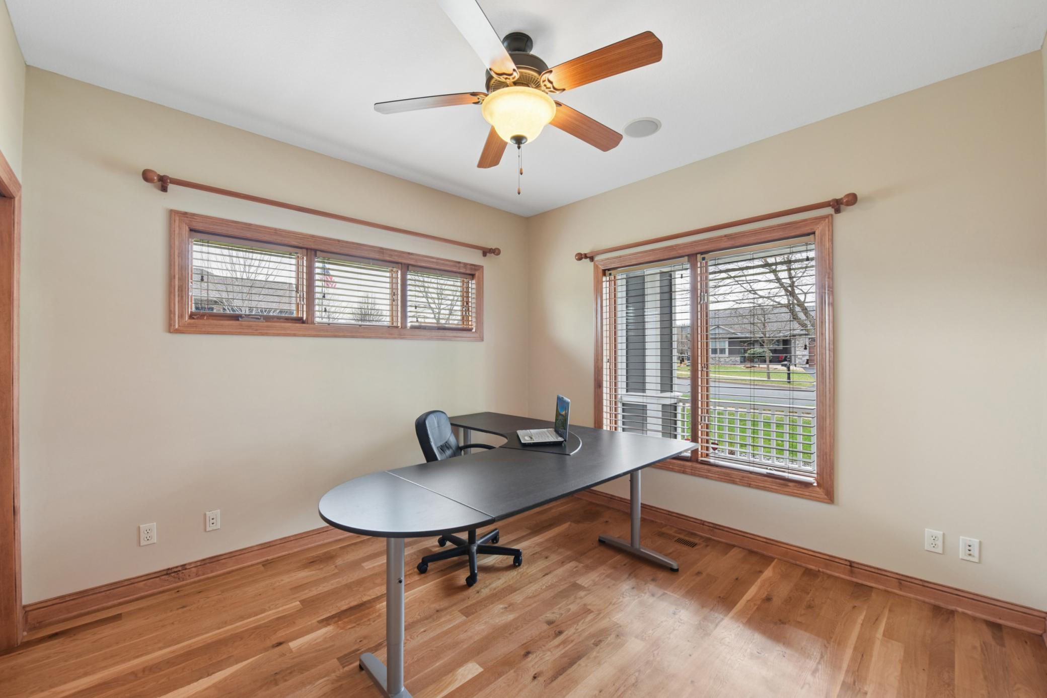 Front office/bedroom off of the front of the home has great size and closet space.