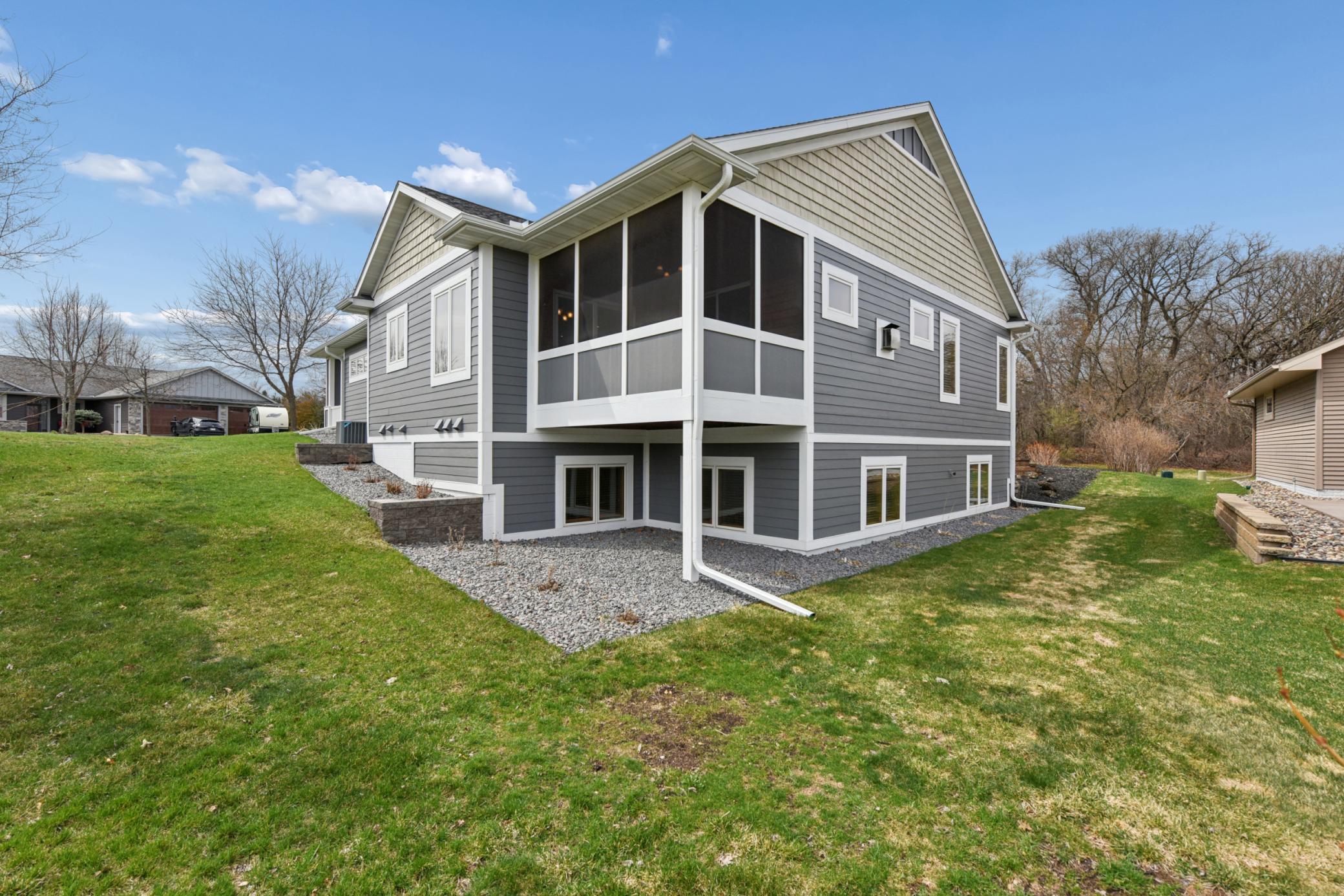 Landscape was totally re-done and really makes the home shine! Screened deck off the back is a great place for hanging out.