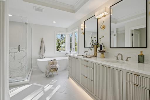 Heated floors, marble, cambria counters, soaking tub