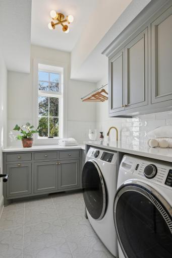 Upper laundry, cambria counters, disaster drain!