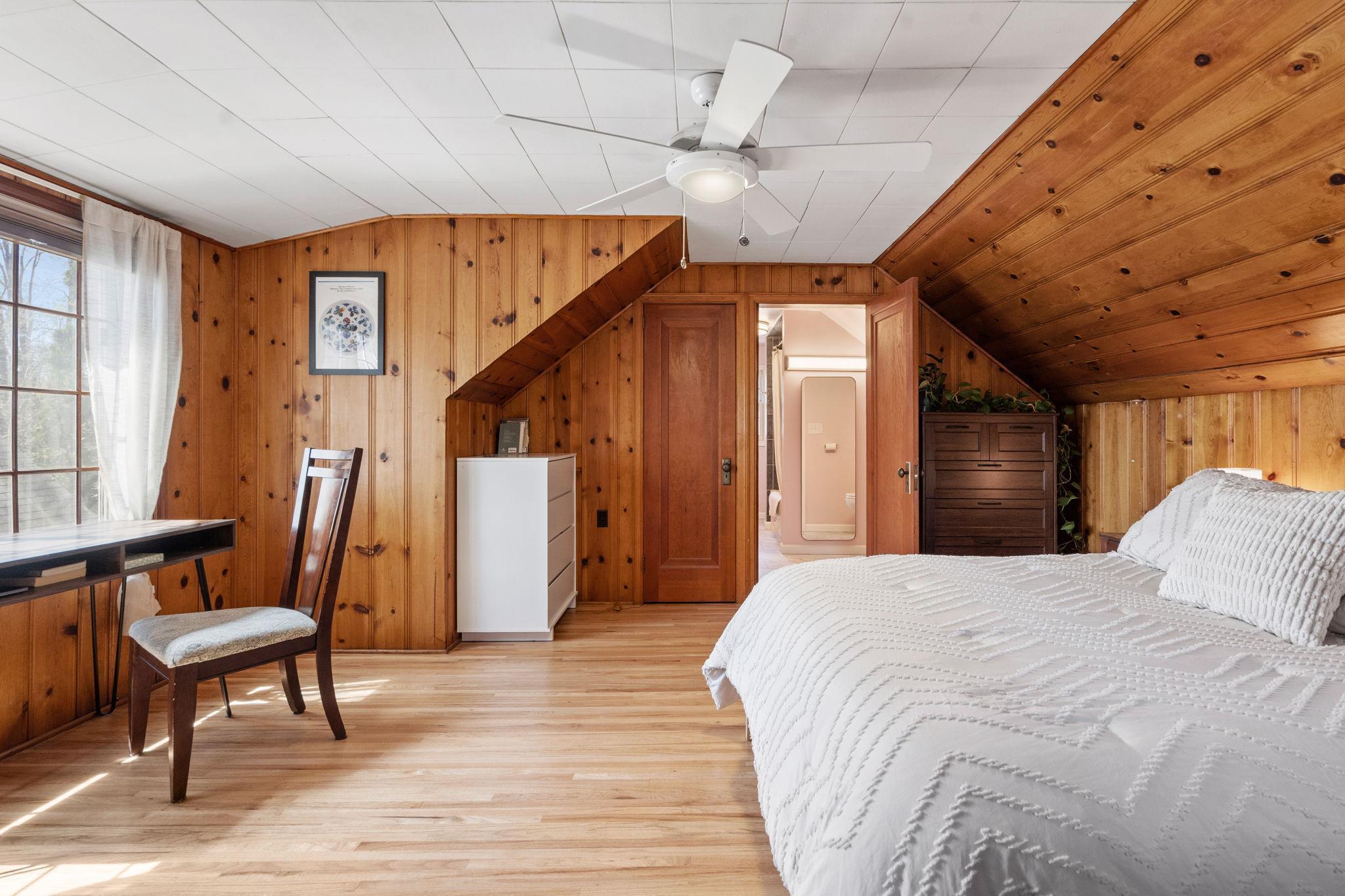 Upper level primary bedroom with a full bathroom.