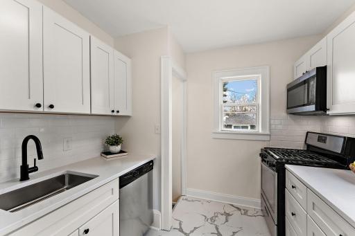 Beautiful remodeled kitchen with quartz countertops and stainless steel appliances!