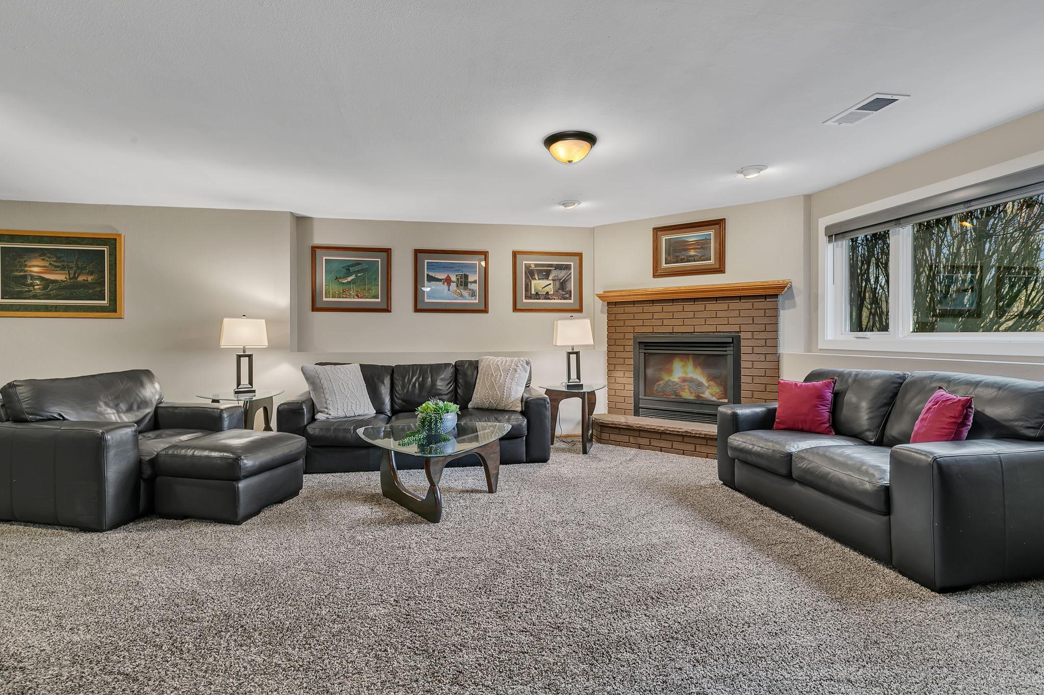 Lower level family room with gas fireplace