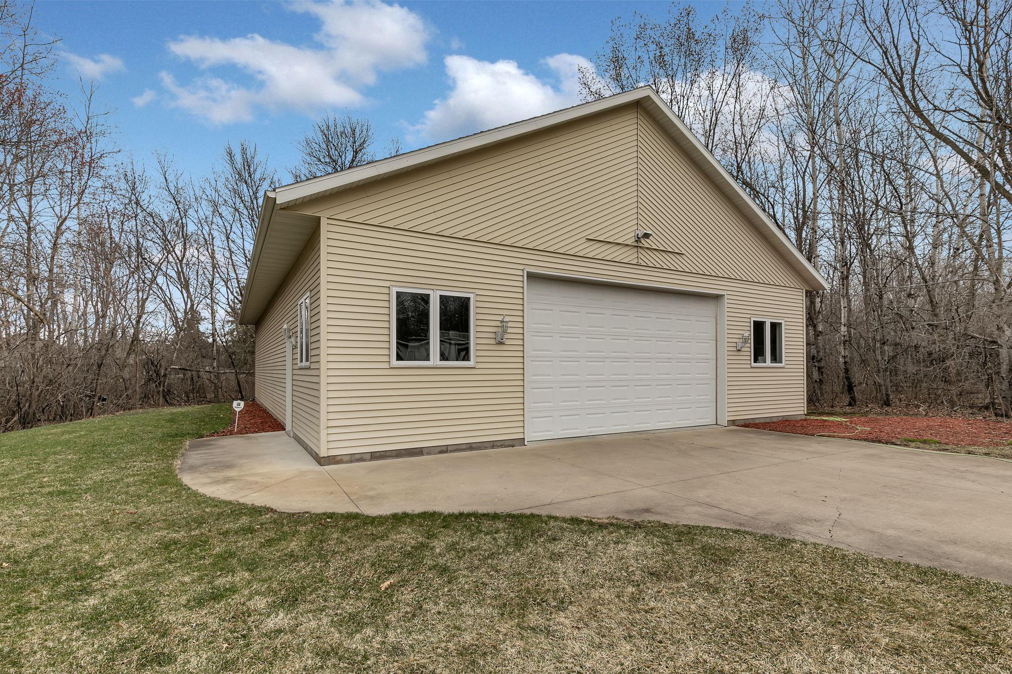 Detached heated 40'x60' shed w/ concrete driveway