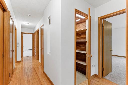 Main level hallway between the 3 bedrooms.