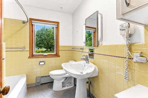 Classic main level full bathroom. Bullet-proof tile!