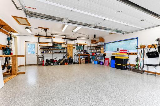 Garage features heated floors, insulated door, and a variety of storage options.