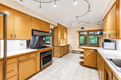 Other end of the kitchen, with a nice little dining nook.