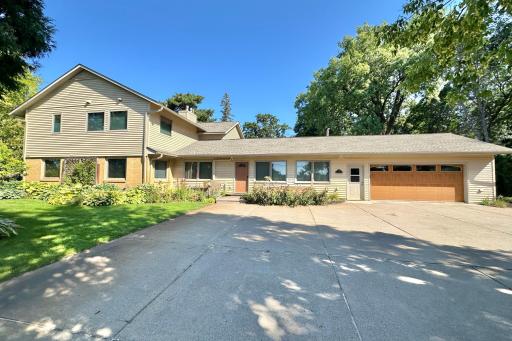 The south side of the home, with 4-car or more driveway.