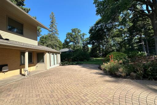 Another view of the patio with the kitchen and enclosed porch on the left.