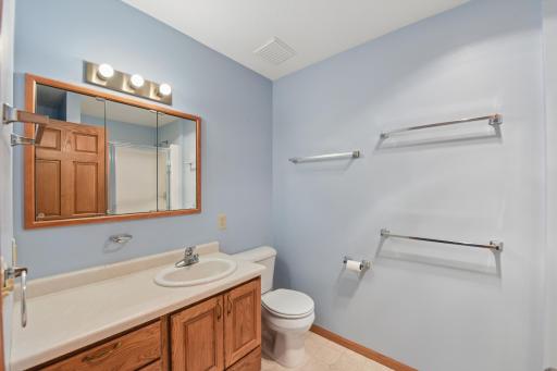 The private bath includes a walk-in shower