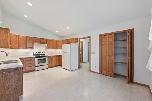 The kitchen offers a nice sized pantry closet, ample cupboard space and room for a table near the window