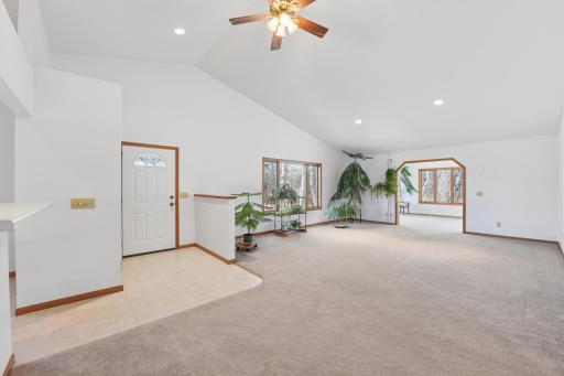 The vaulted ceilings leave an open feeling to the large living area that leads into the sunroom