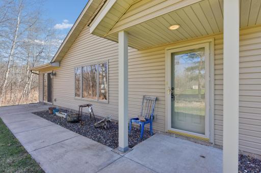 Inviting entrance to the main door and sunroom, ready and waiting for your spring pots and flowers
