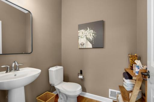 Convenient main-floor half bath, perfectly placed for guests and everyday use.