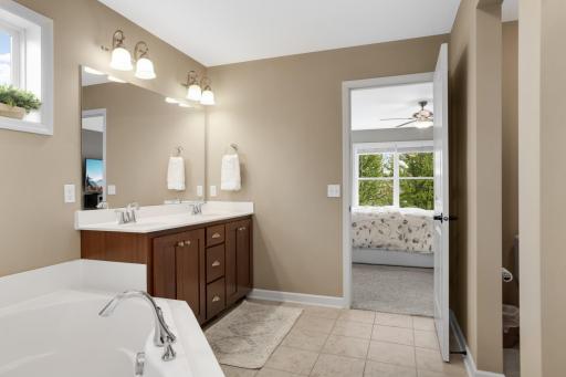 All neutral paint tones pair beautifully with the soft carpeting and crisp white trim, creating a clean, cohesive, and inviting feel throughout.