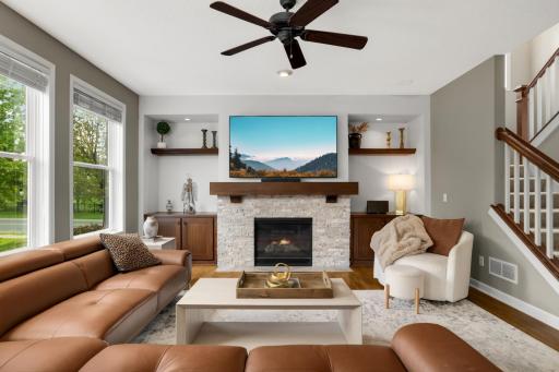 Modern stacked stone gas fireplace serves as a stunning focal point, beautifully visible throughout the open-concept main level