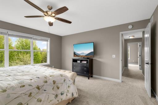 All neutral paint tones pair beautifully with the soft deep pile carpeting and crisp white trim, creating a clean, cohesive, and inviting feel throughout.