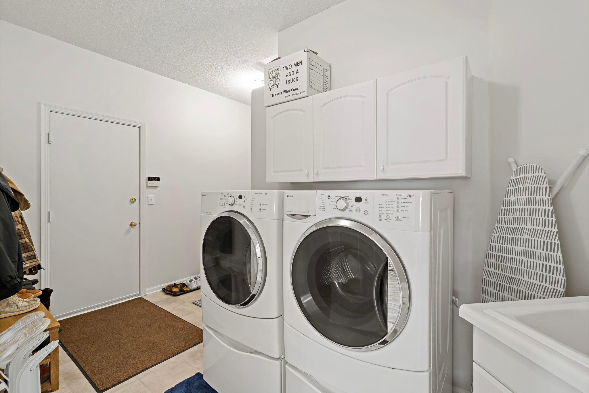So much space from the garage entry—it includes a front-loading washer and dryer, a sink...but wait, there’s more!