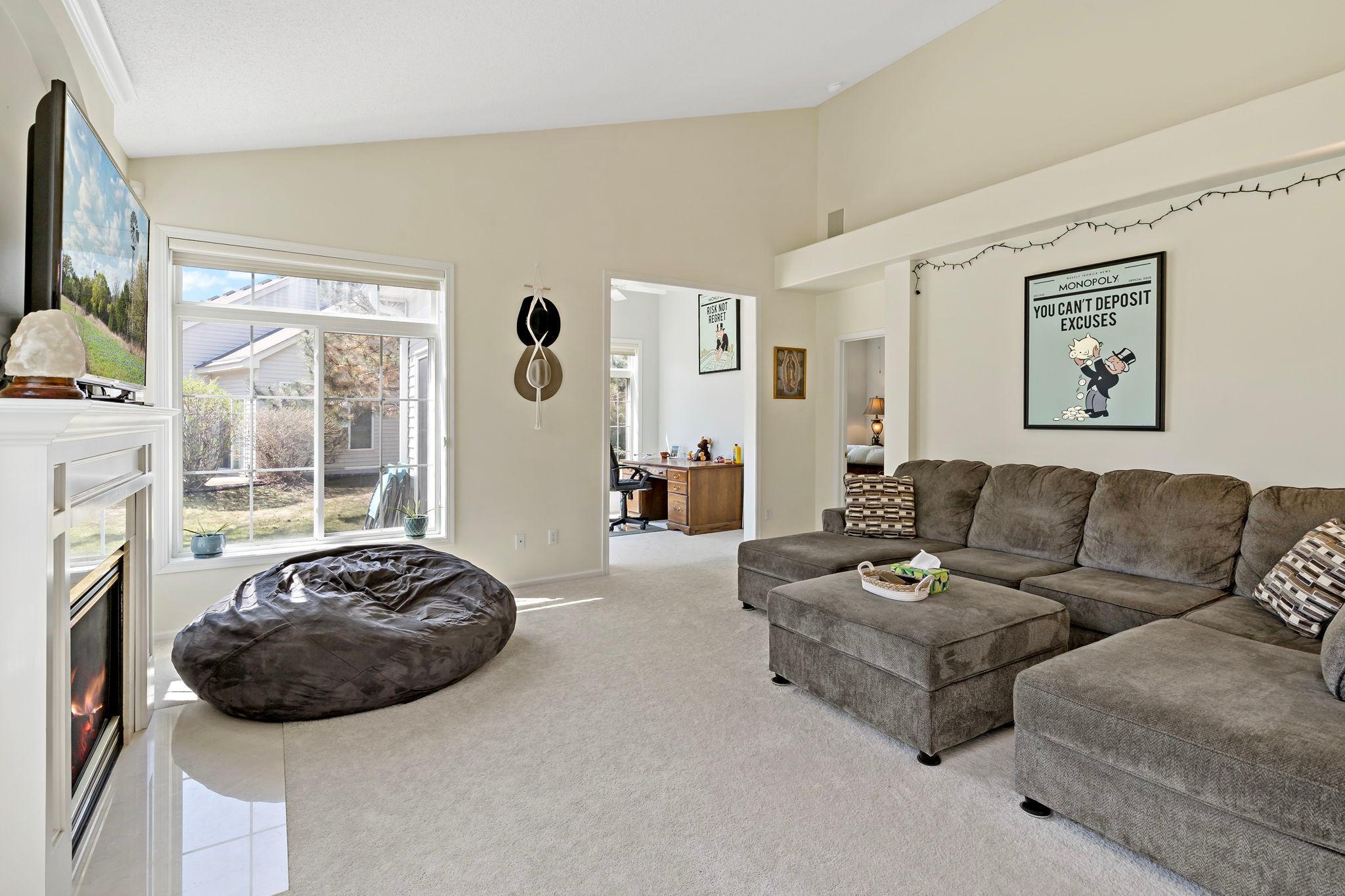 A massive amount of space filled with abundant natural light from all sides, highlighted by vaulted ceilings.