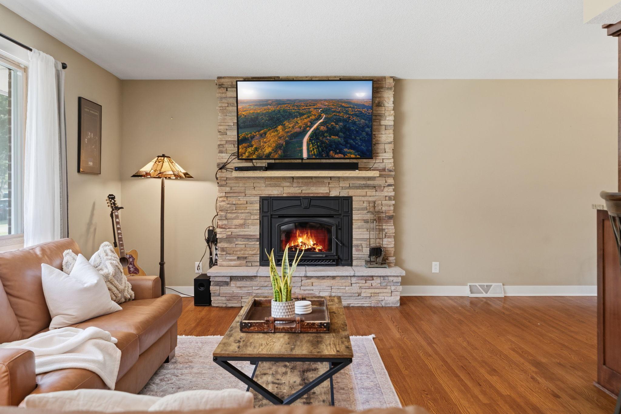 wood burning fireplace w/ stone facade