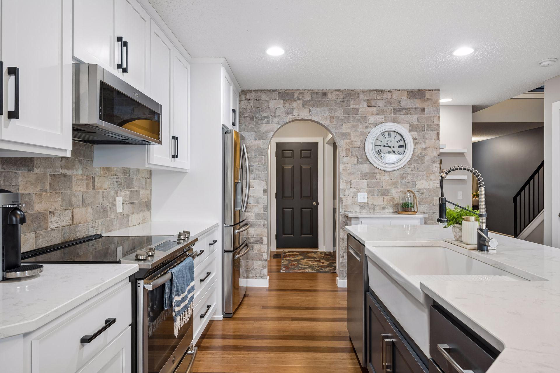 High end stainless appliances and farmhouse sink