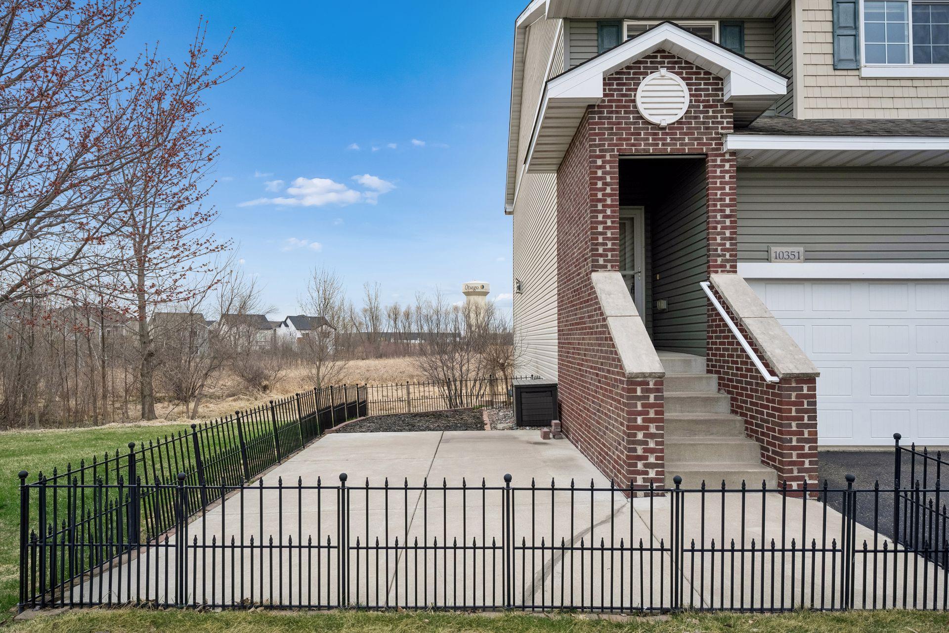 Fenced in concrete patio is perfect for pets or children to play safely
