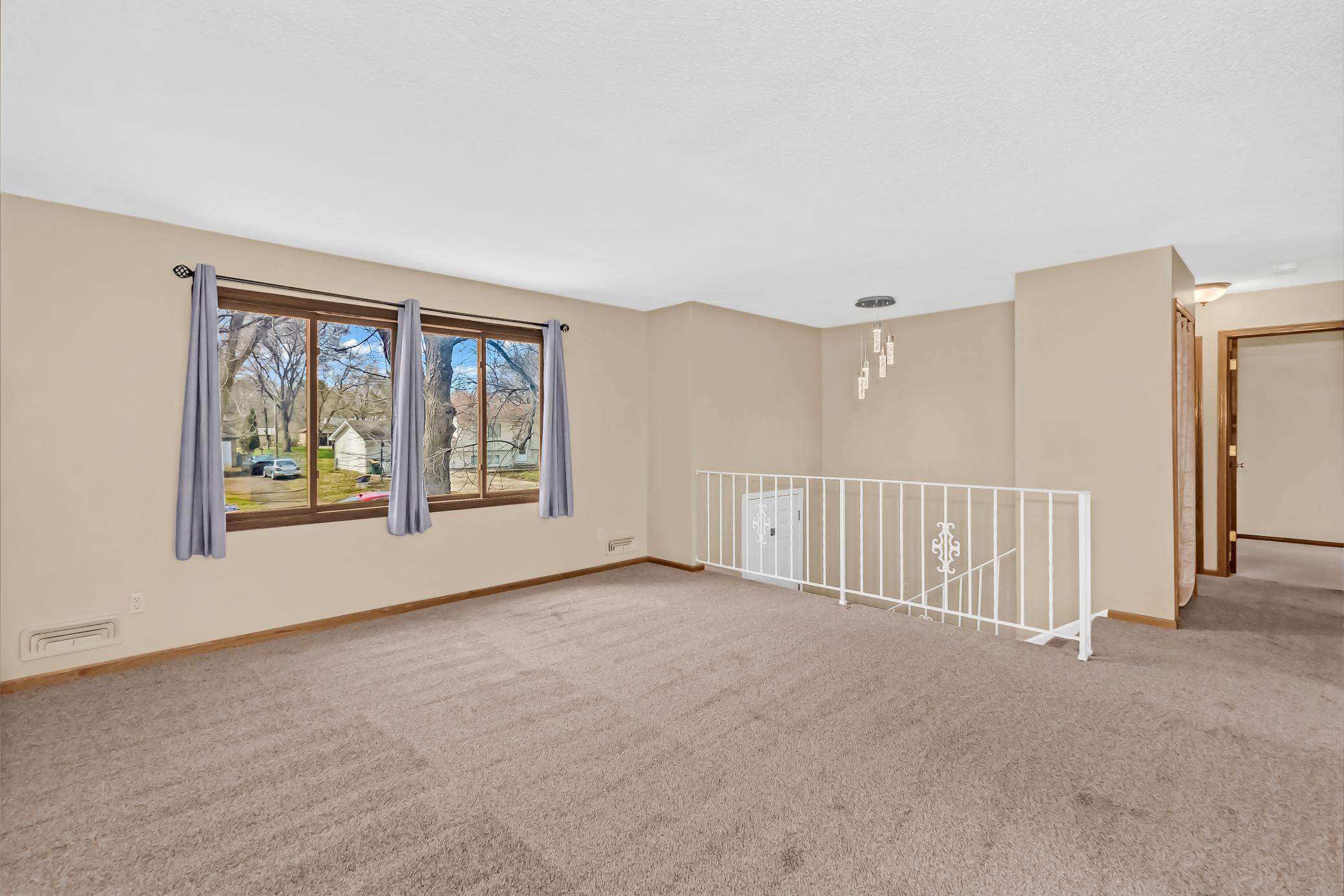 Living Room. Note New Chandelier in Foyer