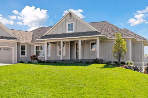 Cozy front porch is perfect for your morning cup of coffee