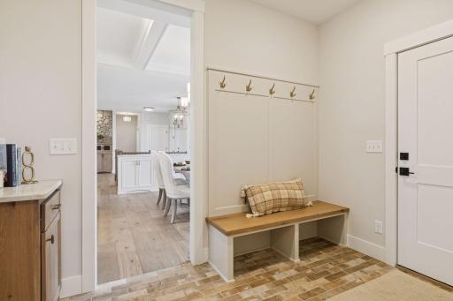 Mudroom off the 3-car garage with bench and hooks