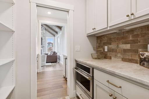 Find your microwave and plenty of storage in the pantry