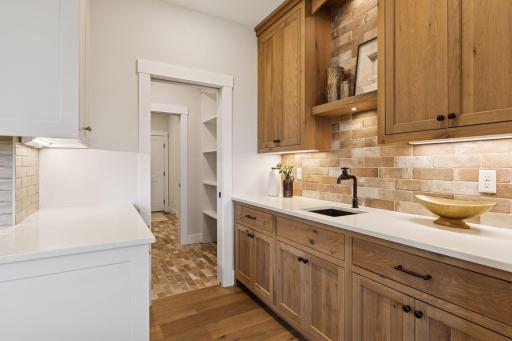Easy flow from wet bar to mud room for ease and convenience
