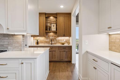 Wet bar with cabinet and counter space off the kitchen