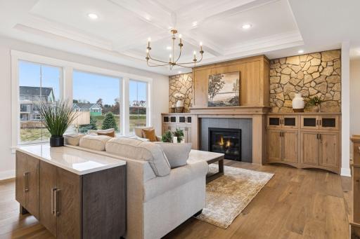 Beautiful, coffered ceilings add a touch of character to them main level living space