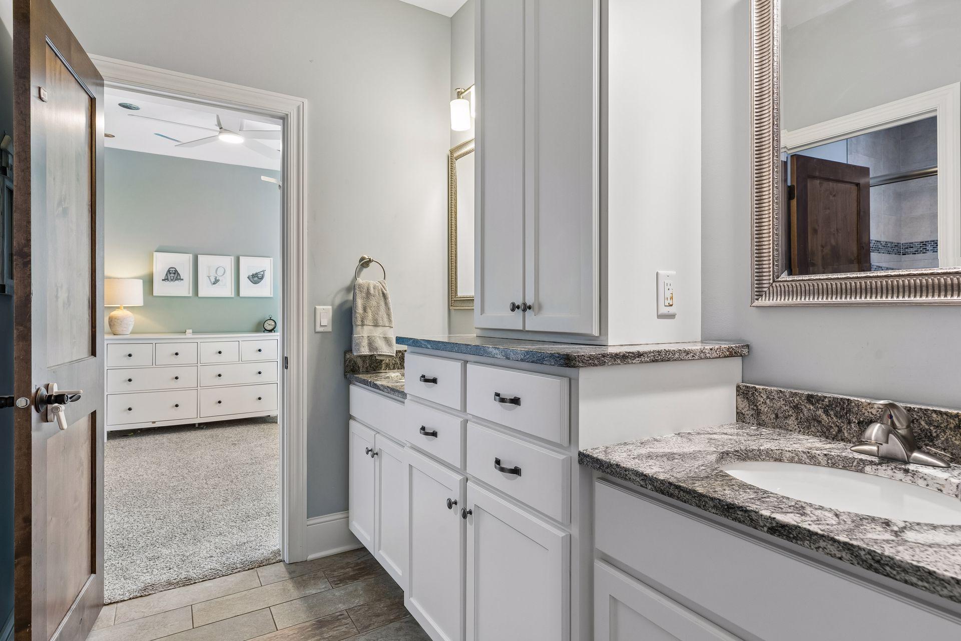 Jack + Jill style with large bathroom connecting bedrooms 2 & 3